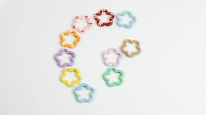 Macro detail of colorful floral alloy spring rings for DIY keychains and accessories