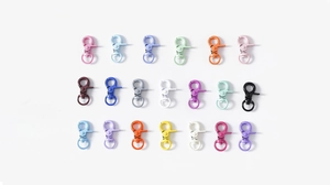 Flat lay of colorful alloy lobster clasps for DIY jewelry and keychain accessories