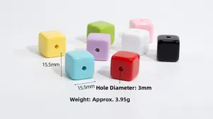 Macro shot of 15.5mm colorful acrylic cube beads showing 3mm hole size and dimensions
