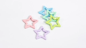 Macro detail of five-pointed star spring rings in vibrant macaron assorted colors