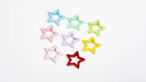 Macro view of colorful star-shaped alloy spring clasps for DIY keychain accessories