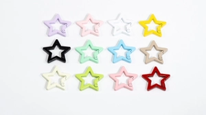 Macro view of star-shaped spring buckles in twelve vibrant assorted colors for DIY keys