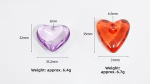 Macro detail of heart acrylic beads in purple and orange with size measurements for DIY jewelry