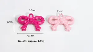 Detail of rose and light pink acrylic bow pendants with dimensions and star accents