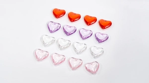Close-up of heart-shaped acrylic beads in assorted colors for DIY jewelry making