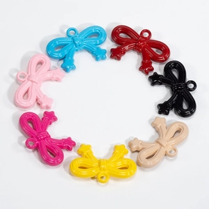 Colorful acrylic bow pendants with star detail and hooks for DIY jewelry making and crafts