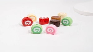 Macro shot of colorful silicone Swiss roll beads showing threading holes for DIY jewelry