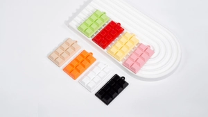 Macro shot of colorful realistic chocolate block charms for DIY keychains and pendants