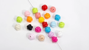 Close-up of colorful spiral acrylic beads for DIY necklaces and phone charms