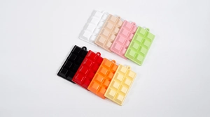 Detailed top view of realistic chocolate bar charms in eight diverse vibrant colors