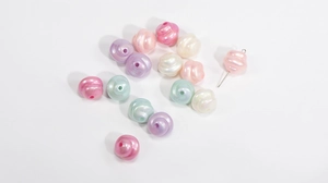 Macro detail of aurora luster spiral resin beads with pastel colors for DIY jewelry crafts