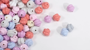 Macro shot of colorful spiral swirl beads with smooth glazed finish for DIY jewelry