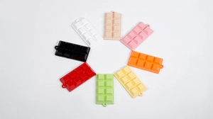 Realistic 2x4 grid chocolate bar keychains in 8 vibrant colors on white background