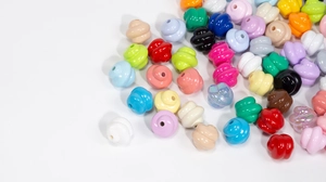 Close-up of colorful spiral-textured resin beads for DIY jewelry making and crafts