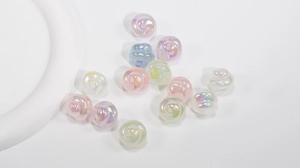 Macro detail of rainbow AB coated resin flower beads with spiral petals for DIY jewelry