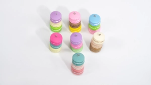 Macro detail of colorful stacked macaroon resin pendants with silver metal hanging loops