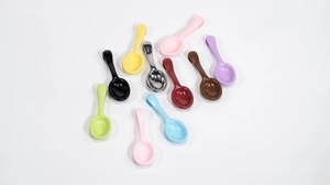 Flat lay of colorful multifunctional spoon clips for DIY crafts in ten vibrant colors