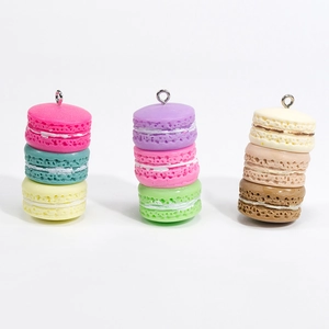 Three colorful layered macaron charms with realistic texture and silver metal hooks