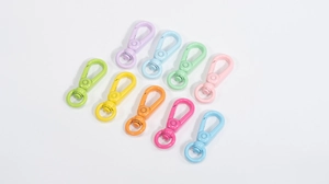 Close-up of colorful spring ring clasps in macaron shades for DIY keychains