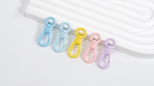 Macro shot of colorful alloy spring lobster clasps for DIY jewelry and keychains