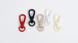 Macro shot of colorful painted alloy swivel lobster clasps for bags and keychains