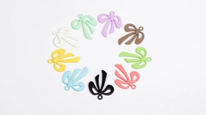 Colorful 9-piece bow pendant set in pastel shades for DIY jewelry and keychain crafts