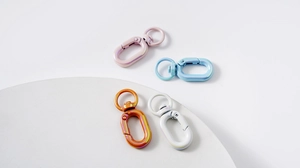 Detail of colorful round spring buckles showing metallic paint finish and 360-degree swivel