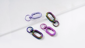 Macro detail of colorful oil slick swivel lobster clasps for DIY jewelry making