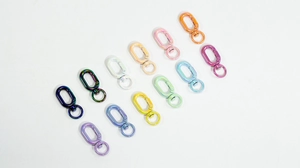 Top view of colorful swivel spring clasps for DIY keychains in various glossy finishes