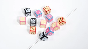 Detailed macro view showing star pattern dice beads with diagonal holes for DIY jewelry
