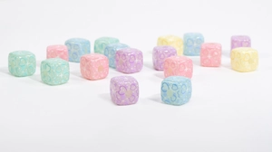 Macro shot of colorful translucent star and heart square beads for DIY crafts