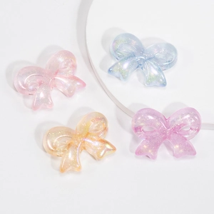 Glittery acrylic bow charms in pastel colors for DIY jewelry making and phone straps