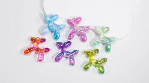 Detailed view of colorful acrylic balloon dog pendants with iridescent AB aurora coating