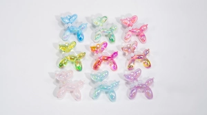 Set of nine colorful gradient acrylic balloon dog charms with pearl collar details