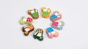 Detailed view of colorful resin drink-shaped beads for DIY jewelry making and crafts