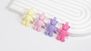 Detail showing 3D candy-colored acrylic bear pendants with polished glossy finish for DIY