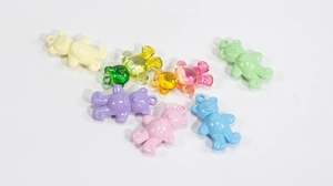 Colorful acrylic bear charms for DIY jewelry making, including transparent and solid colors