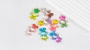 Detail of colorful gradient acrylic bear charms with hanging holes for DIY jewelry