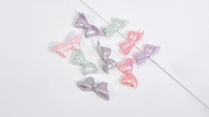 Macro detail of iridescent colorful bow beads for DIY craft and jewelry projects