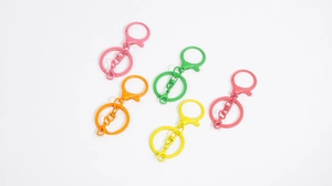 Detail showing colorful painted lobster clasps and key rings for DIY accessories