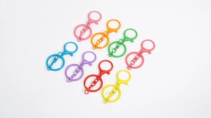 Close-up of colorful matte metal lobster clasps and key rings set in eight vibrant colors