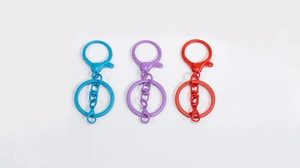 Three colorful matte lacquer swivel lobster clasps with large keyrings in blue and red