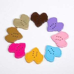 Colorful 6-hole heart-shaped acrylic buttons set in eight vibrant colors on white background