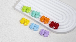 Colorful acrylic bow pendants with hanging loops for DIY jewelry making and crafts