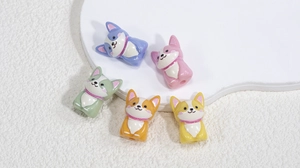 Macro shot of 3D acrylic corgi dog beads in five colors for DIY jewelry and phone charms