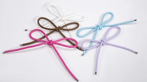 Detail of multi-color woven leather bow pendants with elegant silver metal end caps