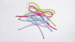 Detail of colorful PU leather bow charms with silver metal tips for bags and accessories