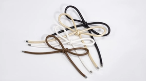 Detail of hand-woven PU leather bow charms with silver metal caps in four classic colors