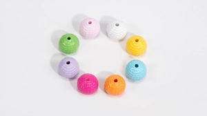 Macro shot of colorful spiral textured acrylic beads for DIY jewelry and necklaces
