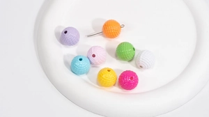 Close-up of colorful 8-color acrylic beads with woven texture for DIY jewelry making